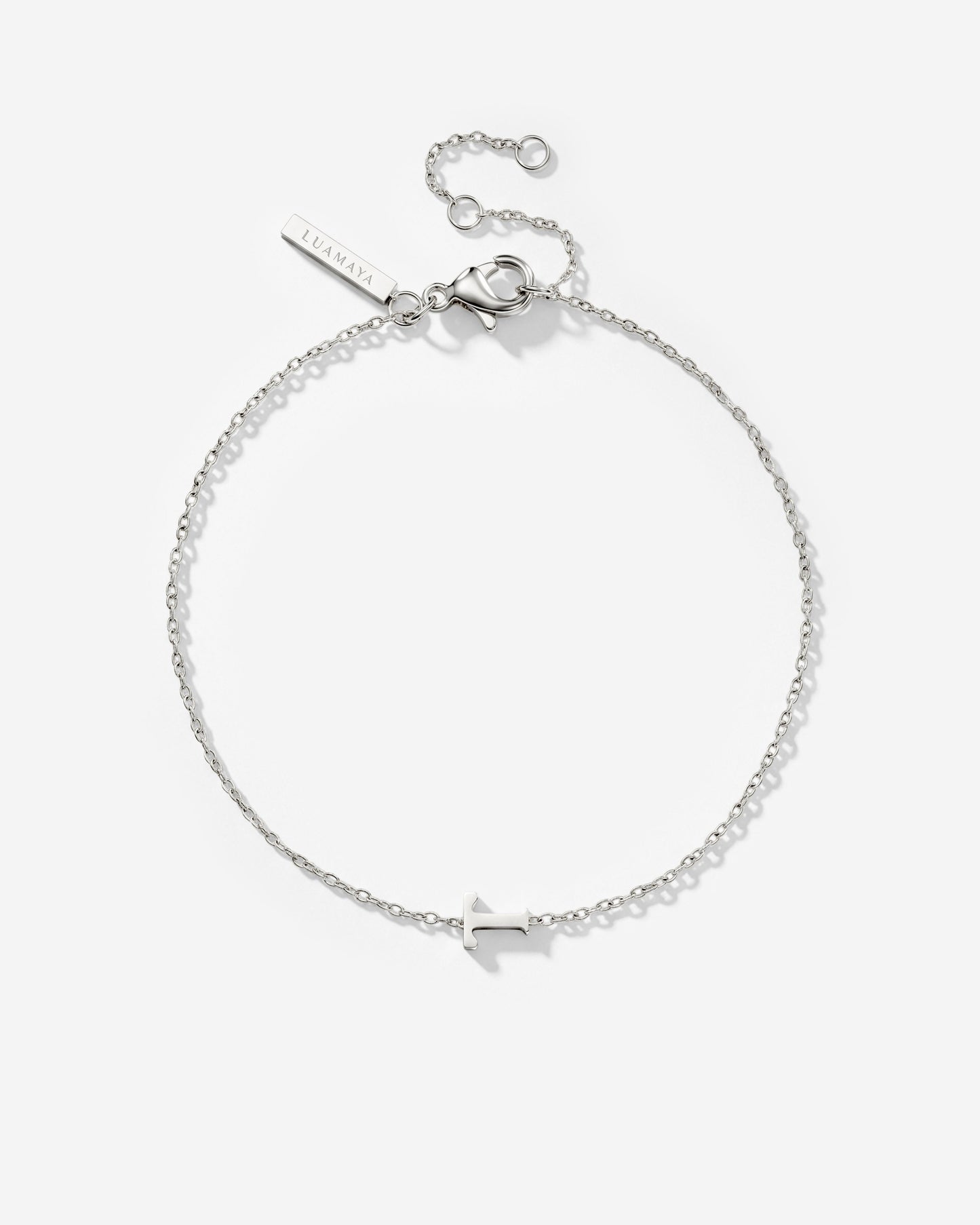 [[Farbe:Silber,Buchstabe:T]]
